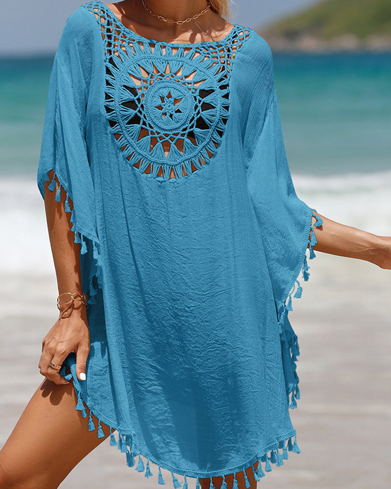 Couverture de plage avec des pompons