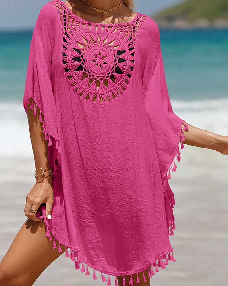 Couverture de plage avec des pompons