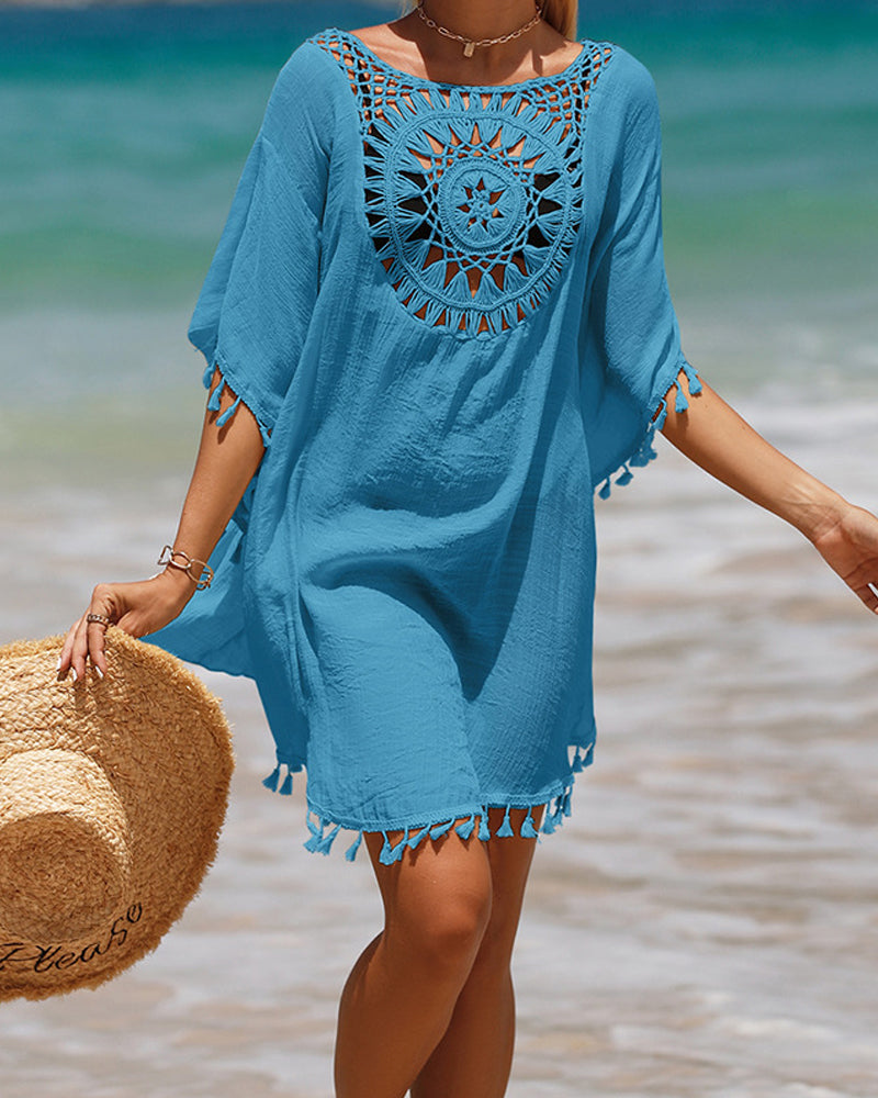 Couverture de plage avec des pompons