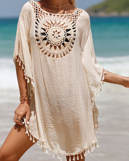 Couverture de plage avec des pompons