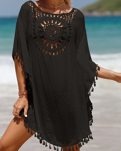 Couverture de plage avec des pompons