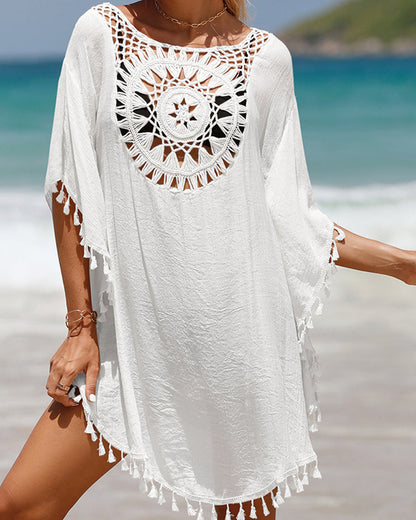 Couverture de plage avec des pompons