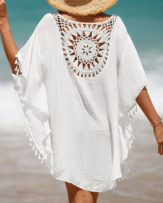 Couverture de plage avec des pompons